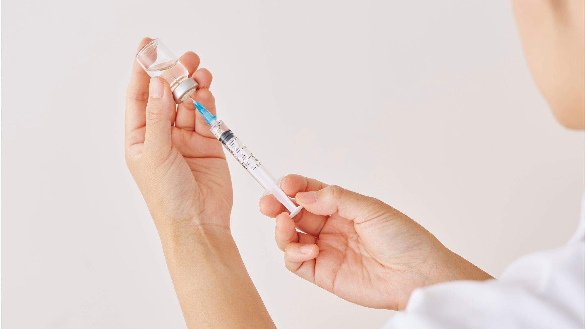 clinician holding vitamin b12 injection