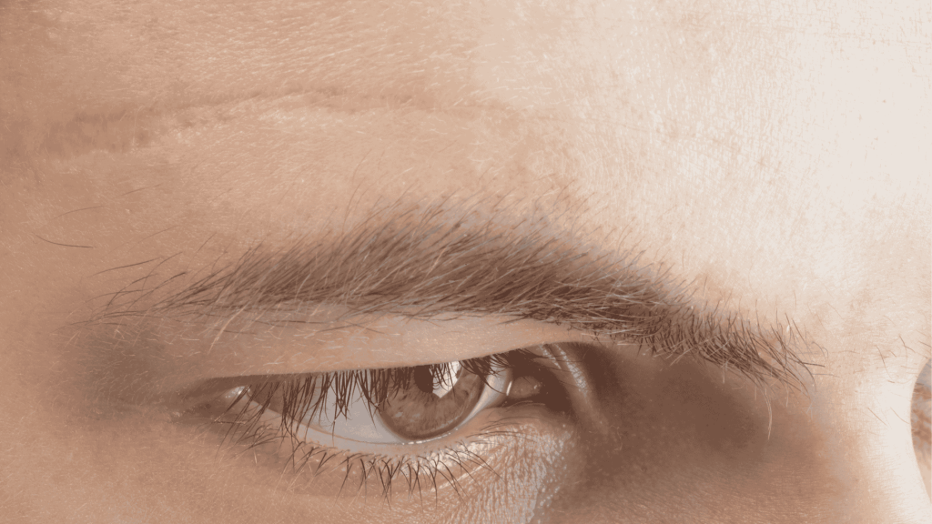 man with scar above eyebrow