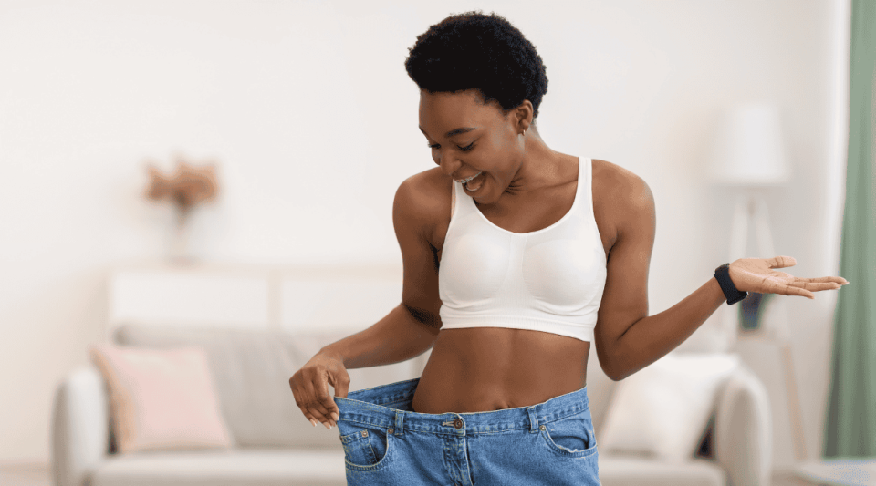 lady wearing jeans that are too big after losing weight